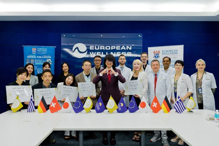 European Wellness Academy — certificate presentation with international delegates